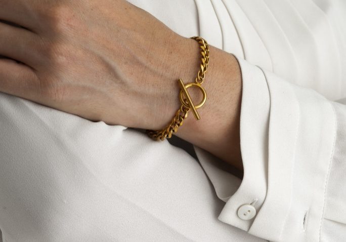 front-view-hand-wearing-gold-bracelet